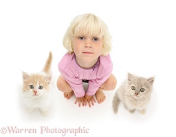 Girl and kittens looking up