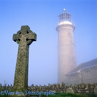 Misty Lundy old lighthouse and grave stone