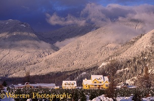 Yellow house in snow scene
