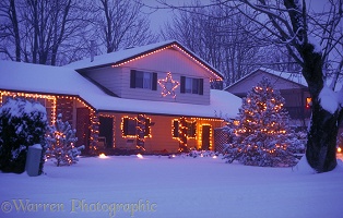 Snowy house with Christmas lights