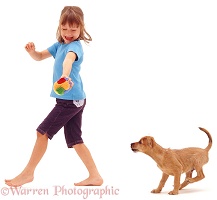 Girl walking with puppy