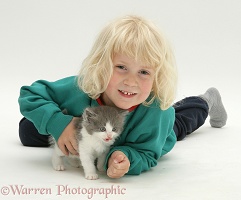 Little girl with grey-and-white kitten