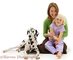 Little girl, lady and Dalmatian
