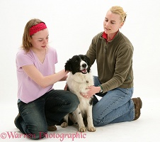 Mother and daughter with black-and-white Border Collie