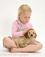 Girl stroking a puppy