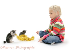 Girl with kittens and tinsel