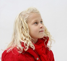 Little girl (5) with red coat and scarf on