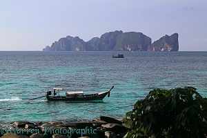 Long-tail boat and Koh Phi Phi Leh island