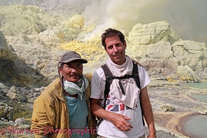 Tourist and man of the sulphur mine at Kawah Ijen