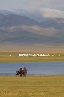 Horse riders and yurts by Song Kul Lake, Kyrgyzstan
